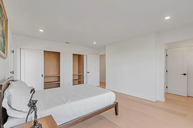 a bedroom with a bed and a cabinets