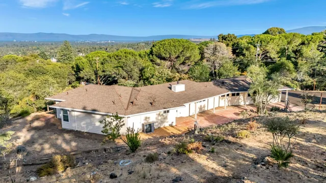 a view of a swimming pool with a yard