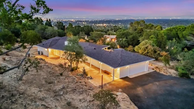 a aerial view of a house with a yard