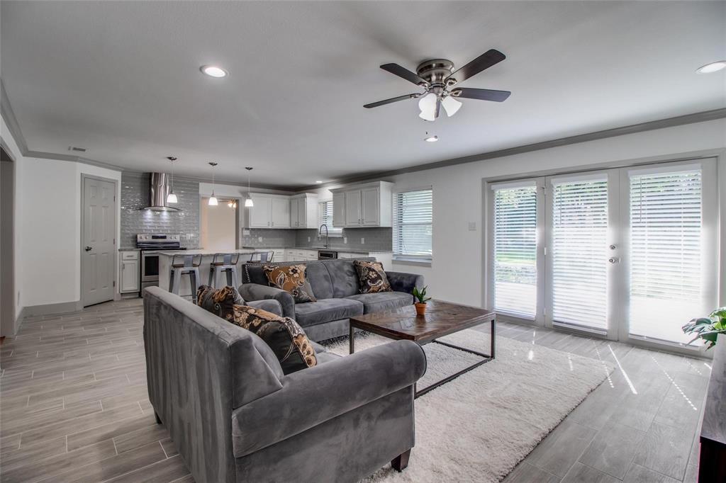 702 Ridgedale Drive Garland, TX 75041 - Photo 2 of 23 a living room with furniture and kitchen view