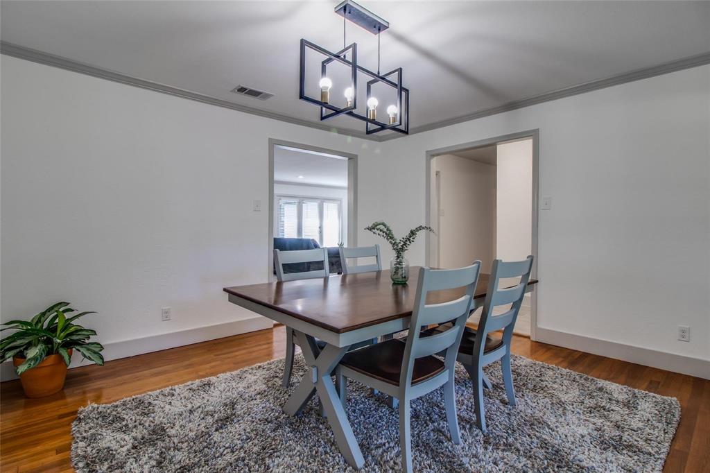702 Ridgedale Drive Garland, TX 75041 - Photo 6 of 23 a dining room with a table and chairs