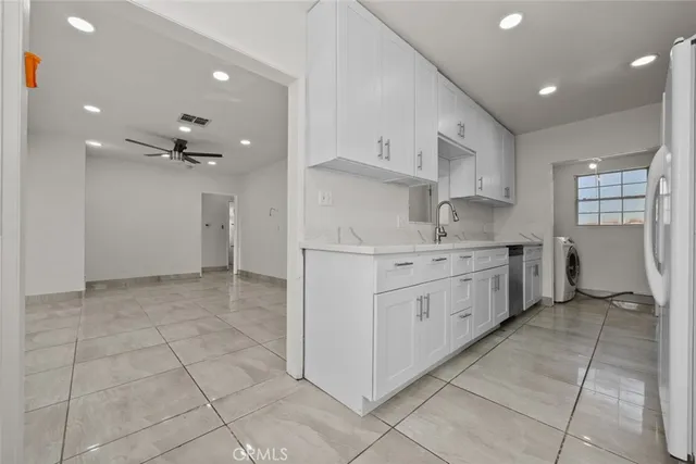 a kitchen with a cabinets and appliances