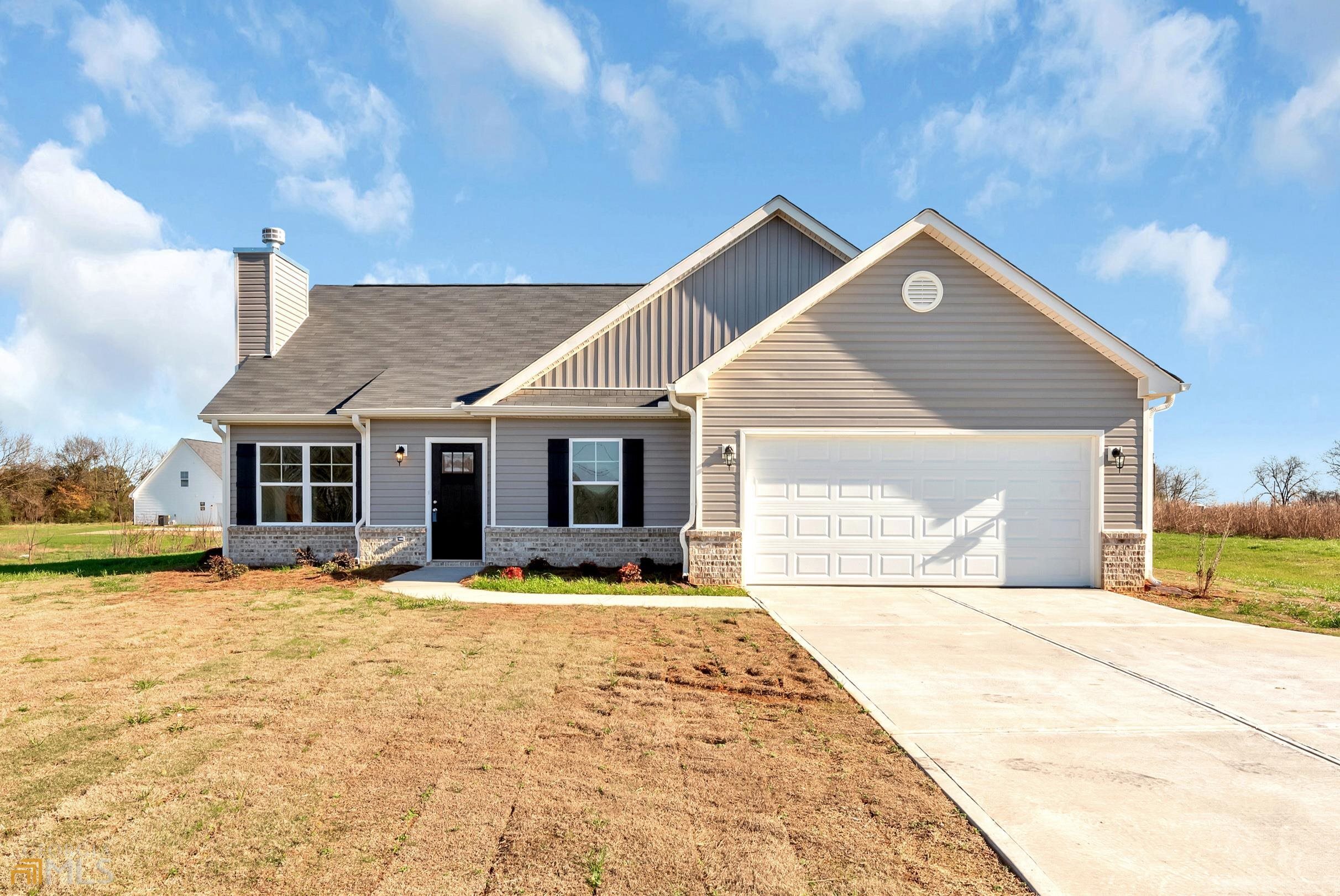 5110 Sandy Cross Road, Unit 9 Carnesville, GA 30521 - Photo 1 of 1 a front view of a house with a yard