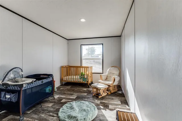 a living room with furniture a rug and a window
