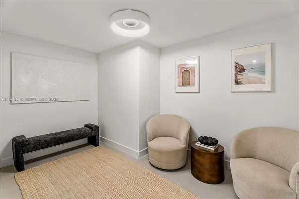 a bedroom with a bed and a wall painting