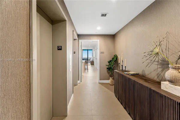 a view of hallway with wooden floor