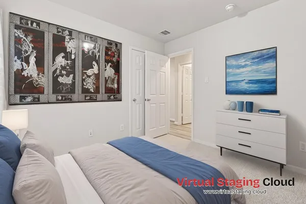 a bedroom with a bed and a cabinet