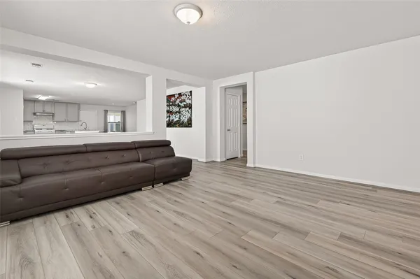 a large white bed in a white room