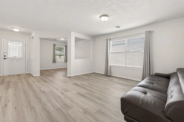 a view of livingroom with furniture and wooden floor