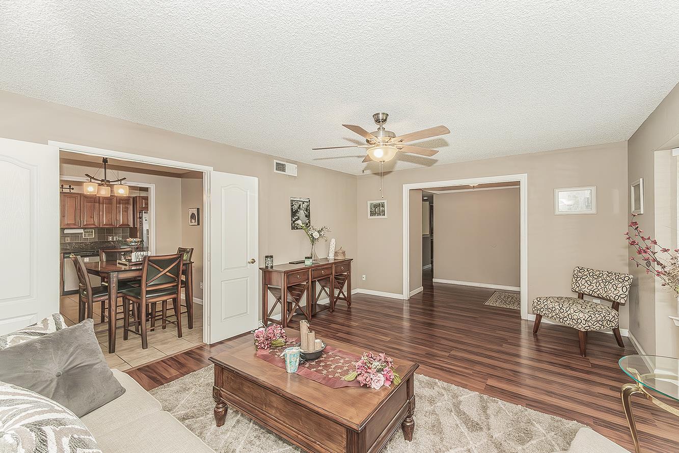 1908 East Niles Avenue Fresno, CA 93720 - Photo 5 of 30 a living room with furniture and wooden floor