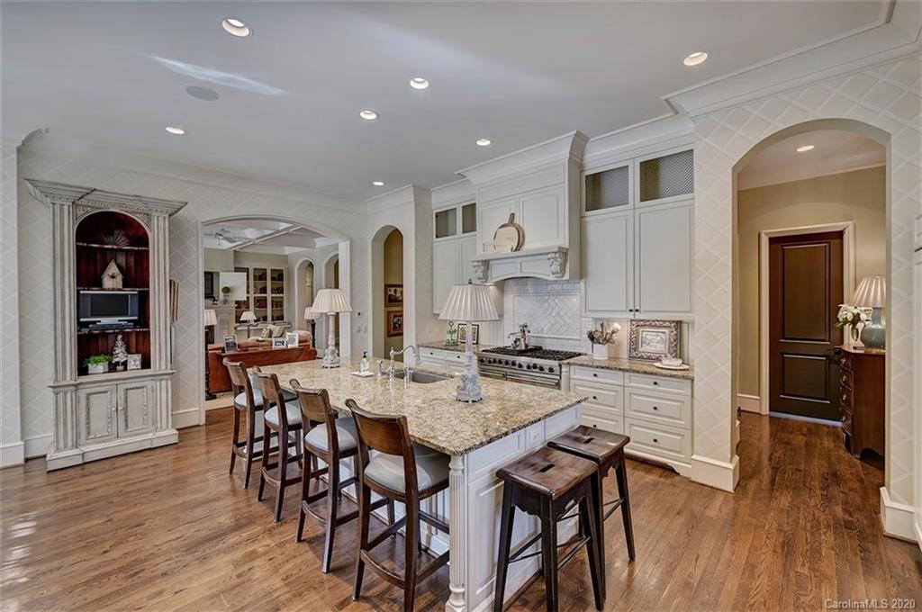 6256 Sharon Hills Road Charlotte, NC 28210 - Photo 12 of 45 a view of a dining room with furniture and wooden floor
