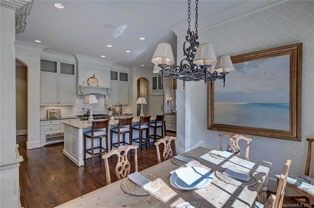 6256 Sharon Hills Road Charlotte, NC 28210 - Photo 14 of 45 a view of a dining room with furniture and wooden floor