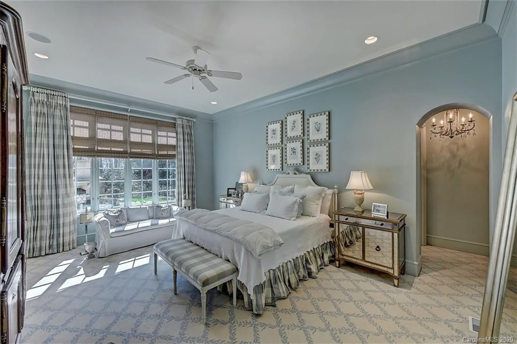 6256 Sharon Hills Road Charlotte, NC 28210 - Photo 19 of 45 a bedroom with a bed and a mirror on dresser