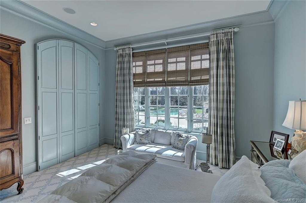 6256 Sharon Hills Road Charlotte, NC 28210 - Photo 20 of 45 a living room with furniture and a floor to ceiling window