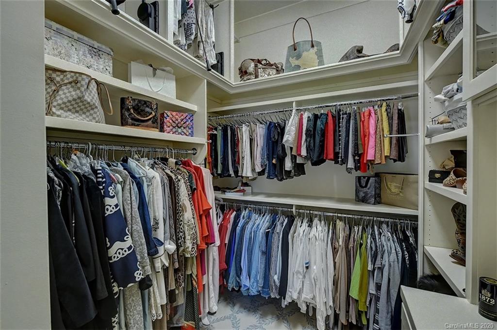 6256 Sharon Hills Road Charlotte, NC 28210 - Photo 24 of 45 a view of walk in closet with clothes and shoes
