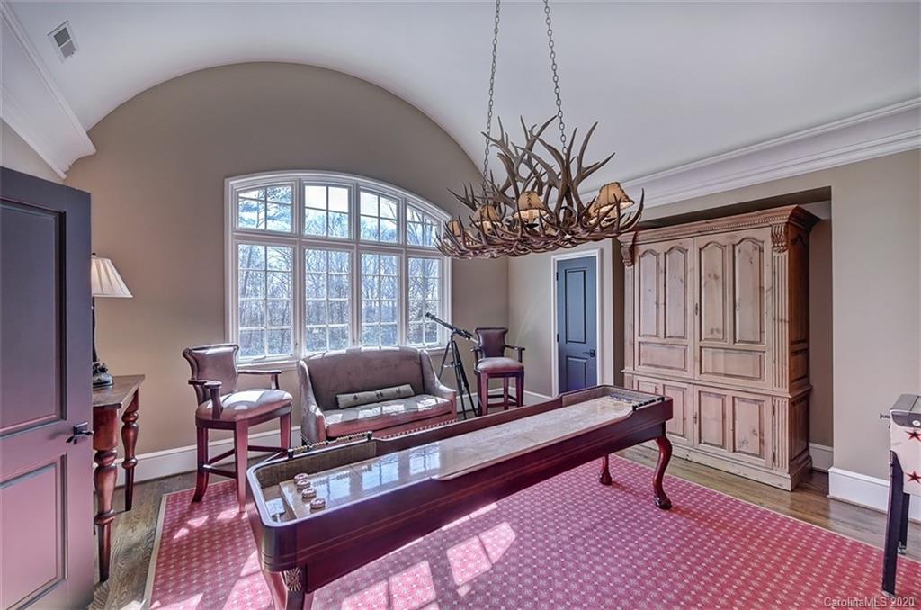 6256 Sharon Hills Road Charlotte, NC 28210 - Photo 27 of 45 a living room with furniture and a large window