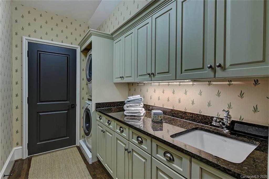 6256 Sharon Hills Road Charlotte, NC 28210 - Photo 29 of 45 a kitchen with granite countertop a sink stove and cabinets