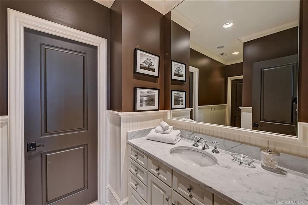 6256 Sharon Hills Road Charlotte, NC 28210 - Photo 31 of 45 a bathroom with a double vanity sink and a mirror