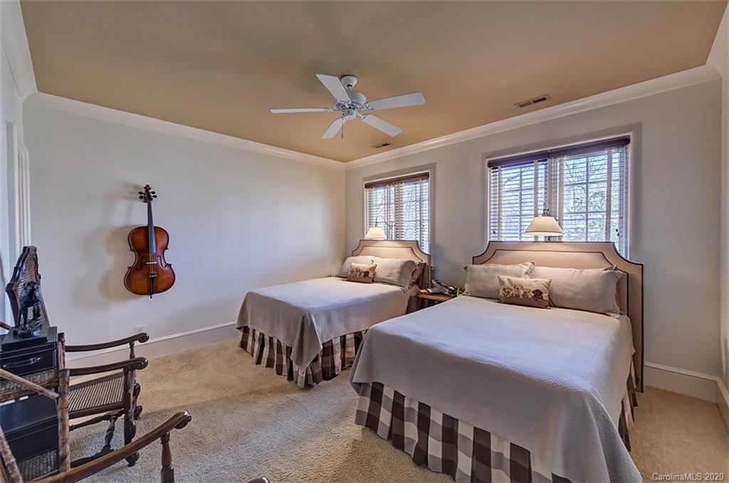 6256 Sharon Hills Road Charlotte, NC 28210 - Photo 32 of 45 a bedroom with two beds and windows