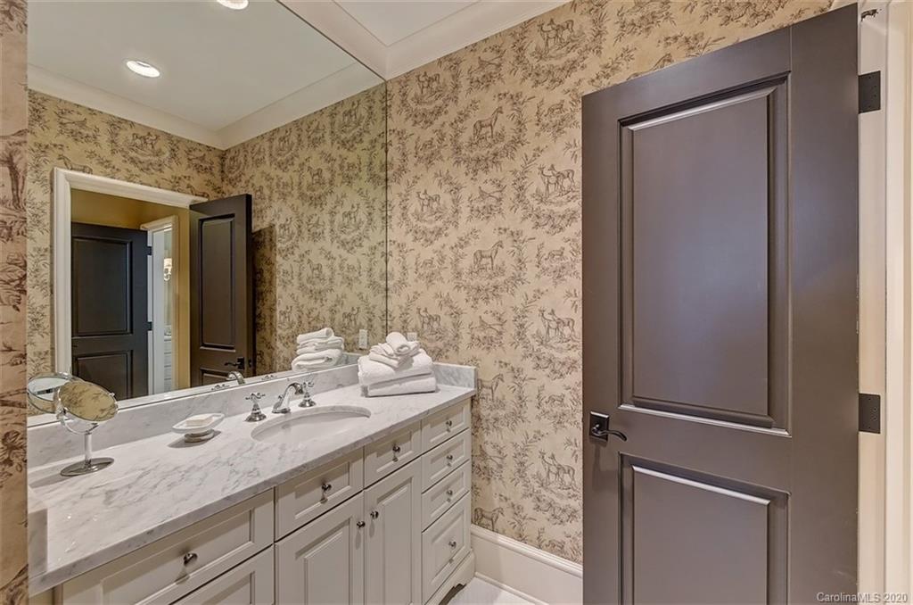 6256 Sharon Hills Road Charlotte, NC 28210 - Photo 33 of 45 a bathroom with a granite countertop sink and a mirror