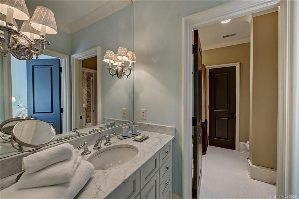 6256 Sharon Hills Road Charlotte, NC 28210 - Photo 35 of 45 a en suite bathroom with a double vanity sink and a mirror