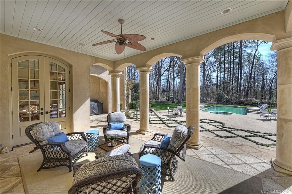 6256 Sharon Hills Road Charlotte, NC 28210 - Photo 36 of 45 a living room with furniture a floor to ceiling window and a table