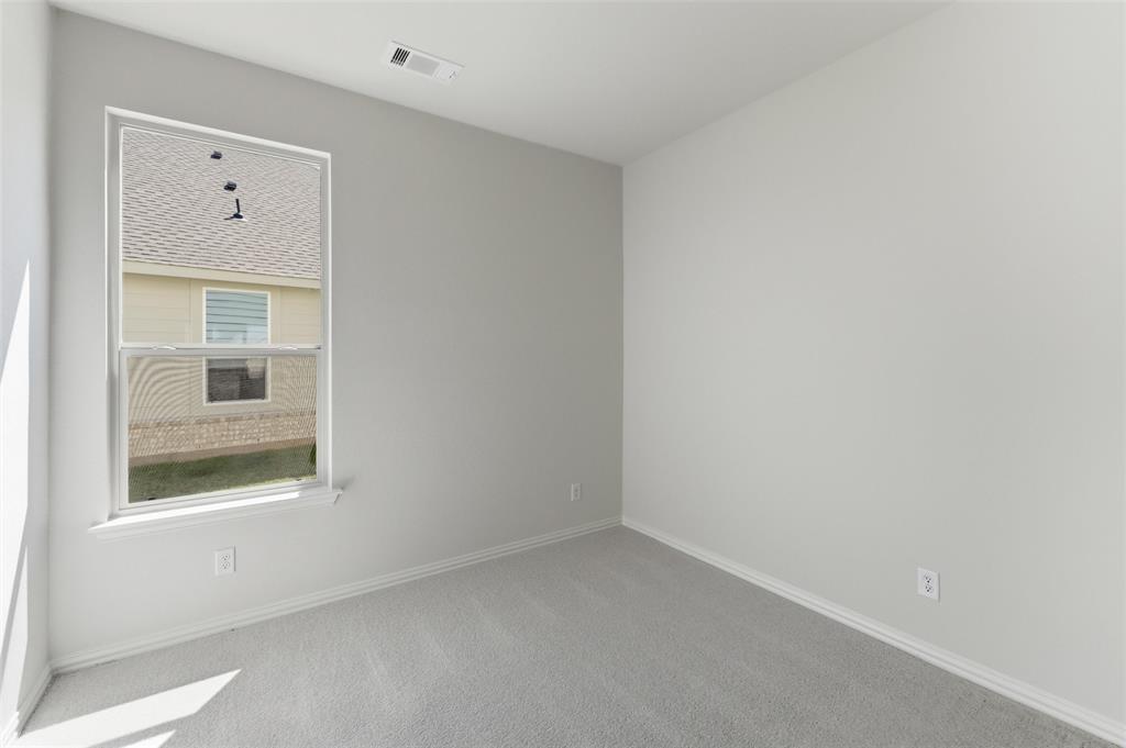 1221 Sabine River Lane Springtown, TX 76082 - Photo 14 of 25 Carpeted empty room featuring baseboards