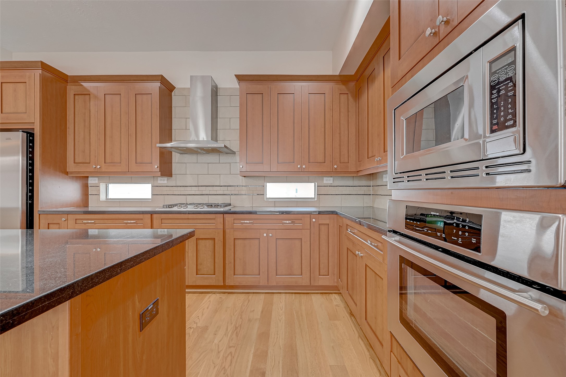 5315 Lillian Street Houston, TX 77007 - Photo 11 of 47 a kitchen with stainless steel appliances granite countertop a sink a stove and cabinets