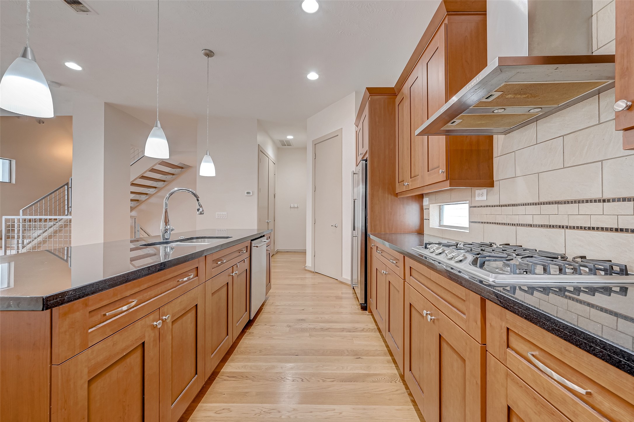 5315 Lillian Street Houston, TX 77007 - Photo 12 of 47 a kitchen with stainless steel appliances a sink and a stove