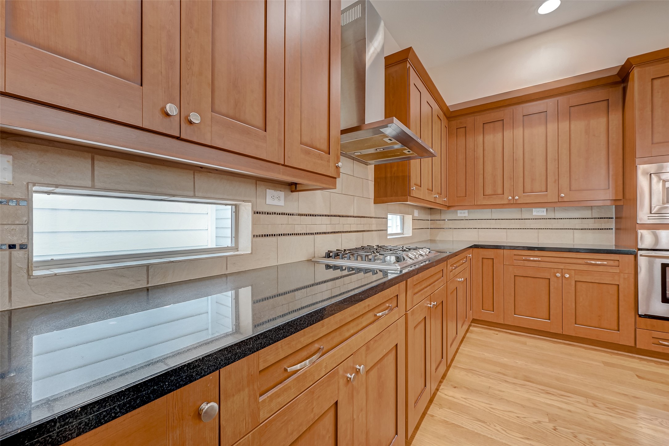 5315 Lillian Street Houston, TX 77007 - Photo 14 of 47 a kitchen with stainless steel appliances granite countertop a sink and cabinets