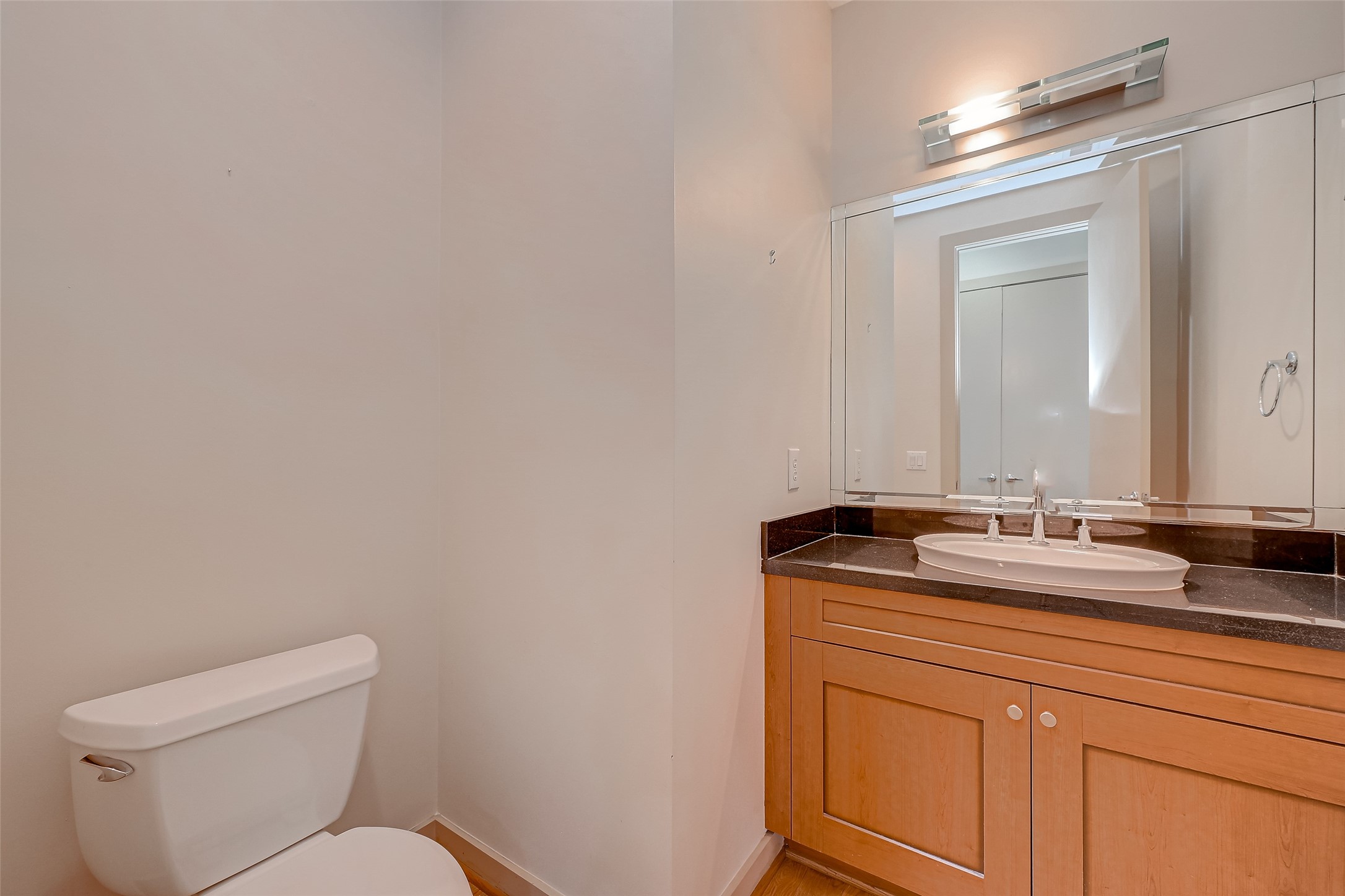 5315 Lillian Street Houston, TX 77007 - Photo 16 of 47 a bathroom with a granite countertop sink vanity mirror and toilet