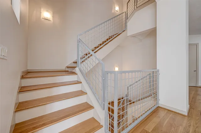 an empty room with a window and a ceiling fan