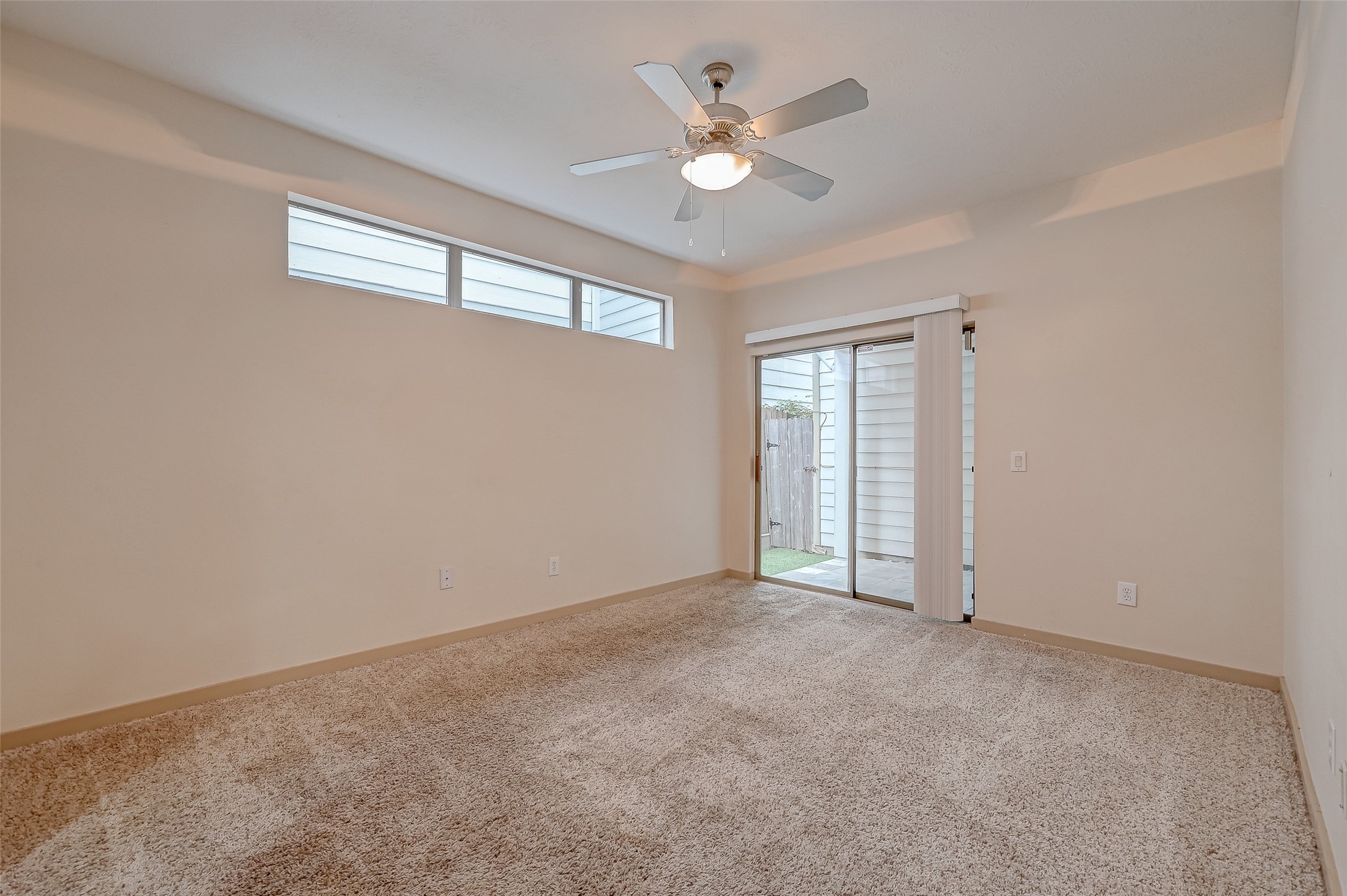 5315 Lillian Street Houston, TX 77007 - Photo 20 of 47 an empty room with a window and a ceiling fan