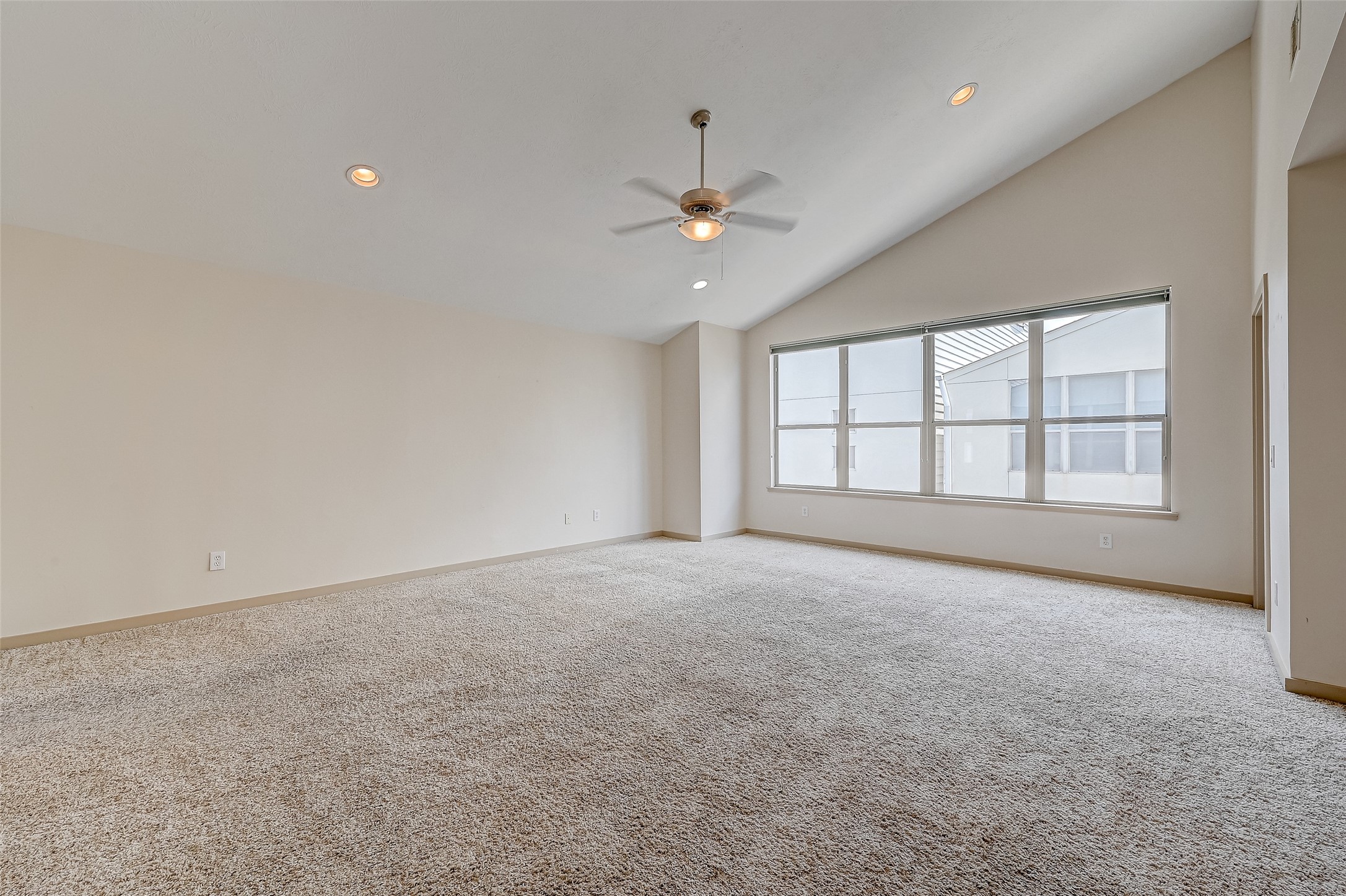 5315 Lillian Street Houston, TX 77007 - Photo 32 of 47 an empty room with chandelier fan and windows