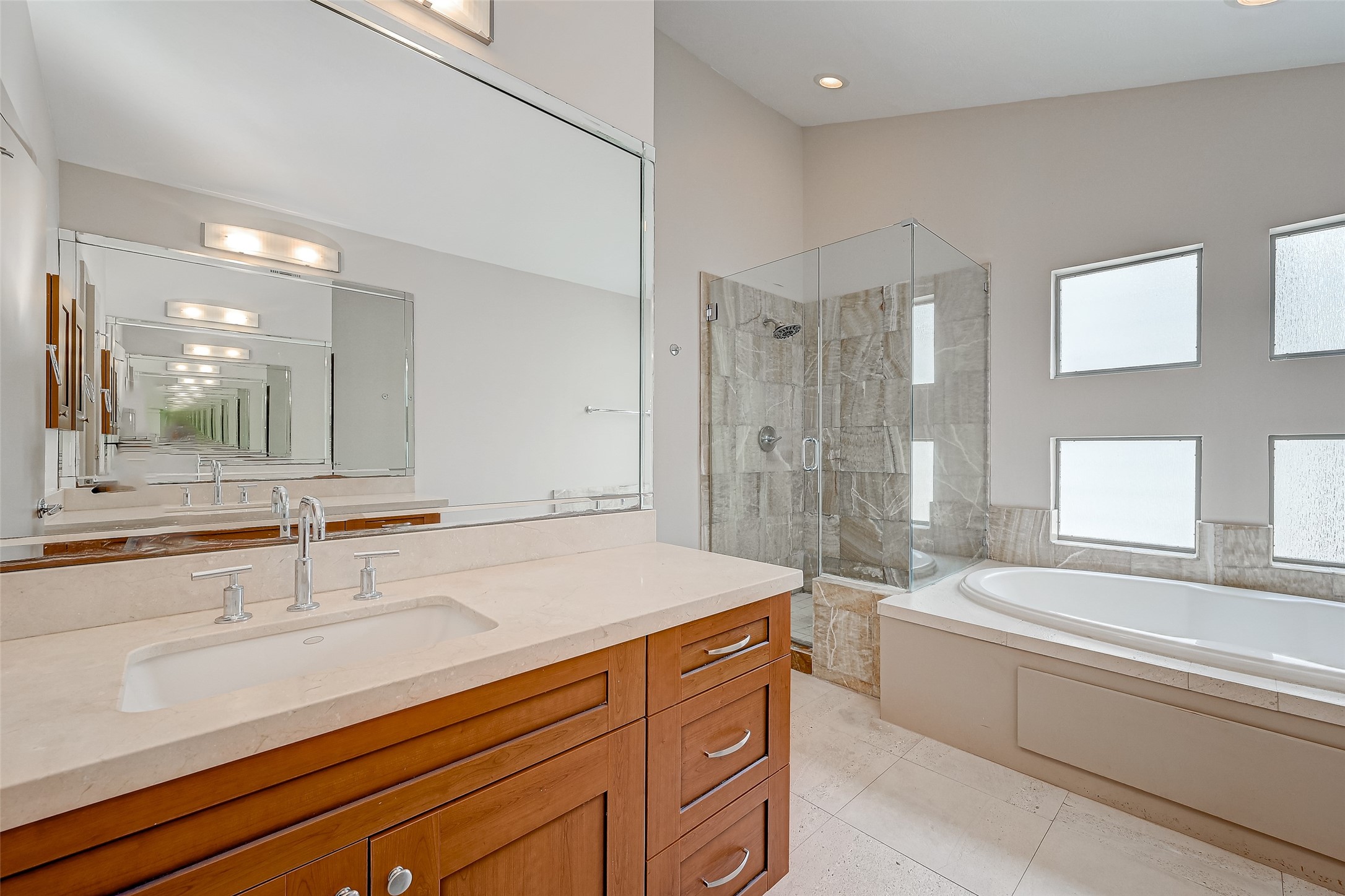 5315 Lillian Street Houston, TX 77007 - Photo 38 of 47 a spacious bathroom with a sink mirror and a bath tub