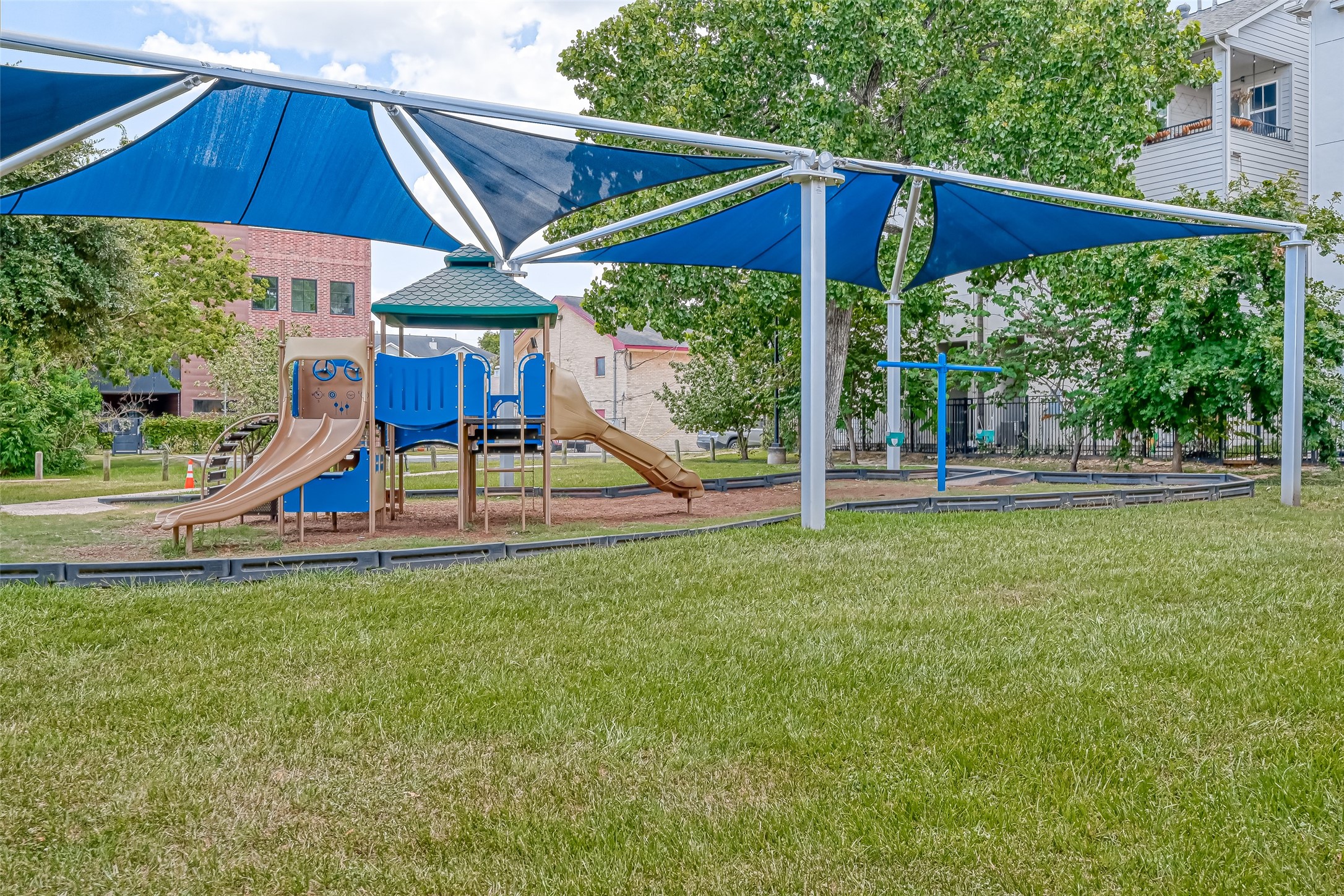5315 Lillian Street Houston, TX 77007 - Photo 45 of 47 a view of a big yard with table and chairs under an umbrella