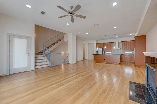 a view of a kitchen with a sink and a refrigerator