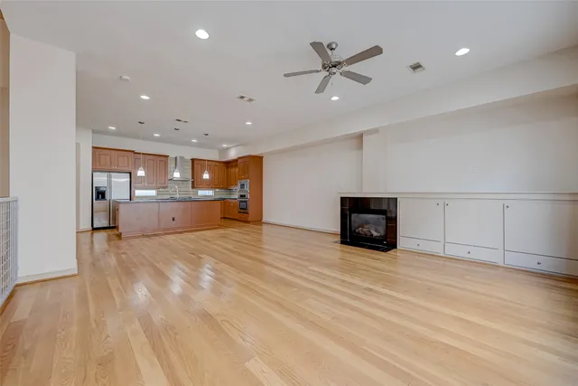 a kitchen with granite countertop a stove top oven and cabinets