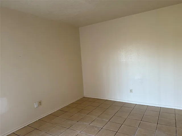 a bathroom with a bathtub and window