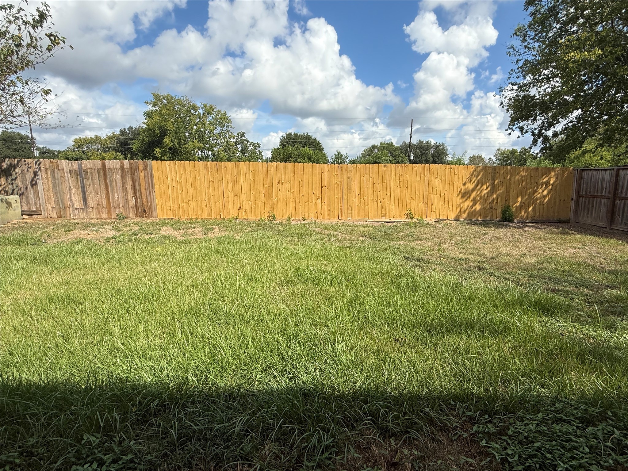 2114 West Greens Road Houston, TX 77067 - Photo 16 of 16 a view of a yard with an outdoor space
