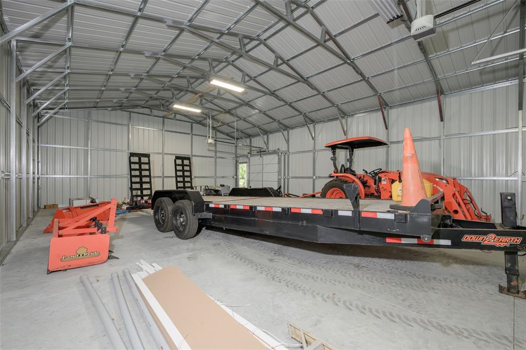374 Sisco Road Pomona Park, FL 32181 - Photo 27 of 40 a view of parking garage with cars