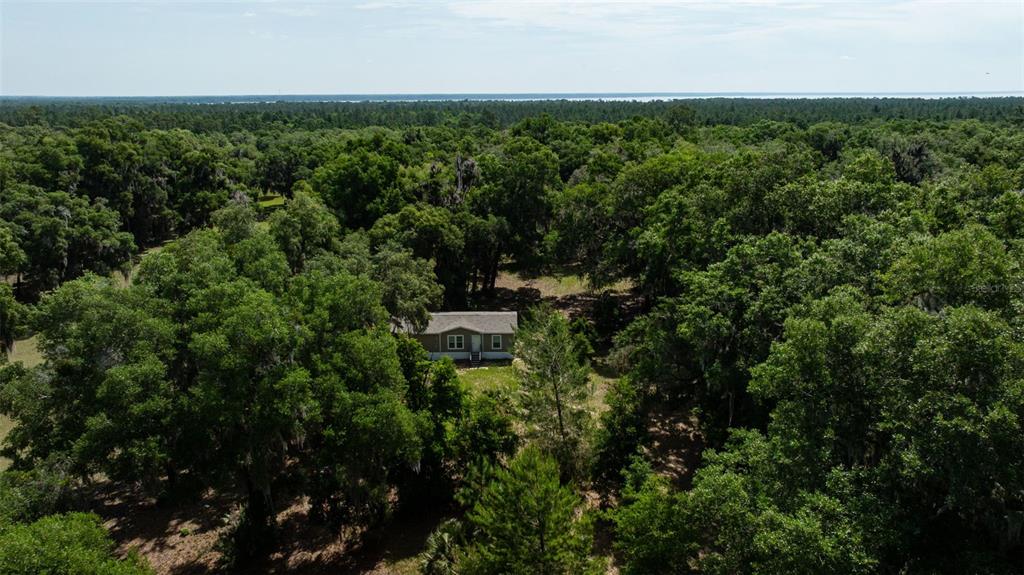 374 Sisco Road Pomona Park, FL 32181 - Photo 37 of 40 an aerial view of a house with a yard