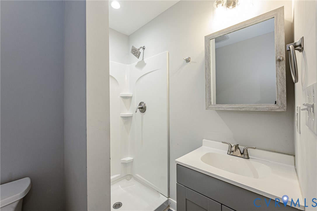 2015 Fordson Road Richmond, VA 23229 - Photo 18 of 48 Bathroom featuring a shower stall with built-in sh