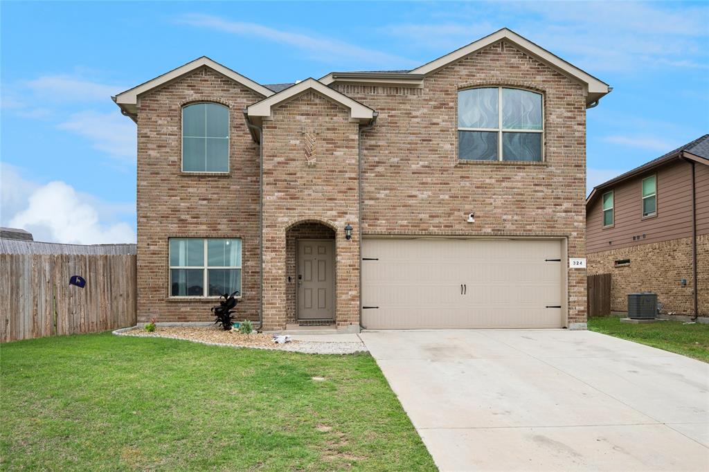 324 Fairgrounds Lane Ponder, TX 76259 - Photo 1 of 40 a front view of a house with garden