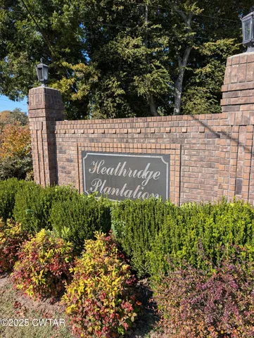 a view of a sign under a large building