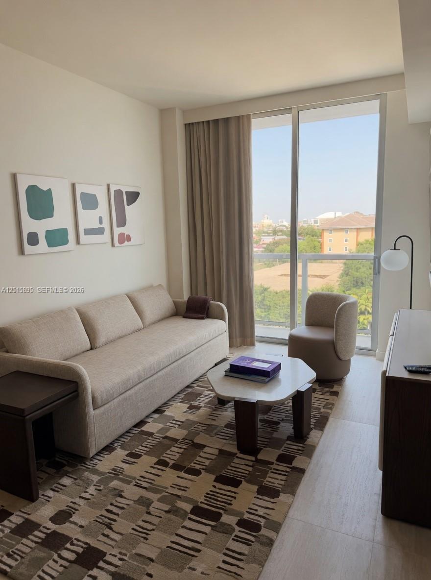 1611 Southwest 2nd Avenue, Unit 707 Miami, FL 33129 - Photo 6 of 9 a living room with furniture and a large window