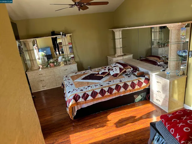 a bedroom with a bed and dresser