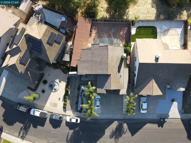 an aerial view of residential houses with outdoor space