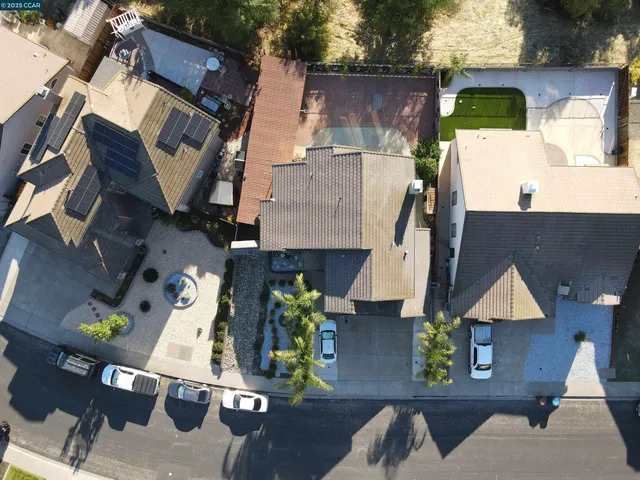 an aerial view of residential houses with outdoor space