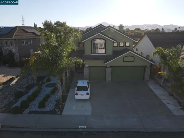 a view of multiple houses with a street